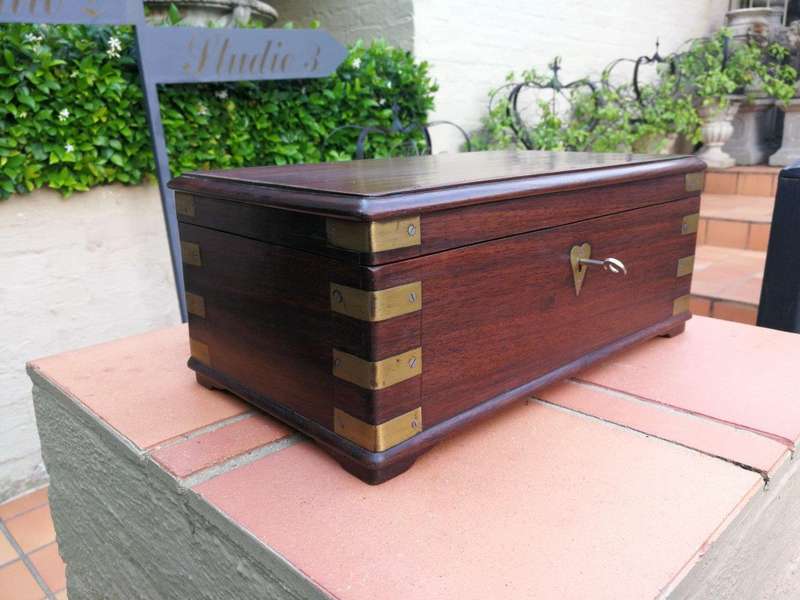A Mahogany Polished Box With Brass details and Escutcheon and Key