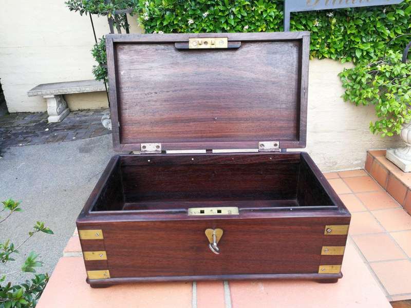 A Mahogany Polished Box With Brass details and Escutcheon and Key