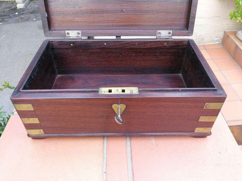 A Mahogany Polished Box With Brass details and Escutcheon and Key