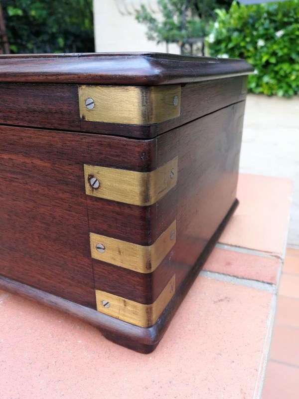 A Mahogany Polished Box With Brass details and Escutcheon and Key