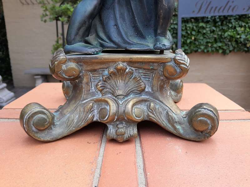 An Antique Brass And Bronze Five Arm Cherub Candelabra