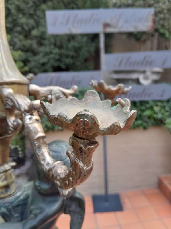 An Antique Brass And Bronze Five Arm Cherub Candelabra