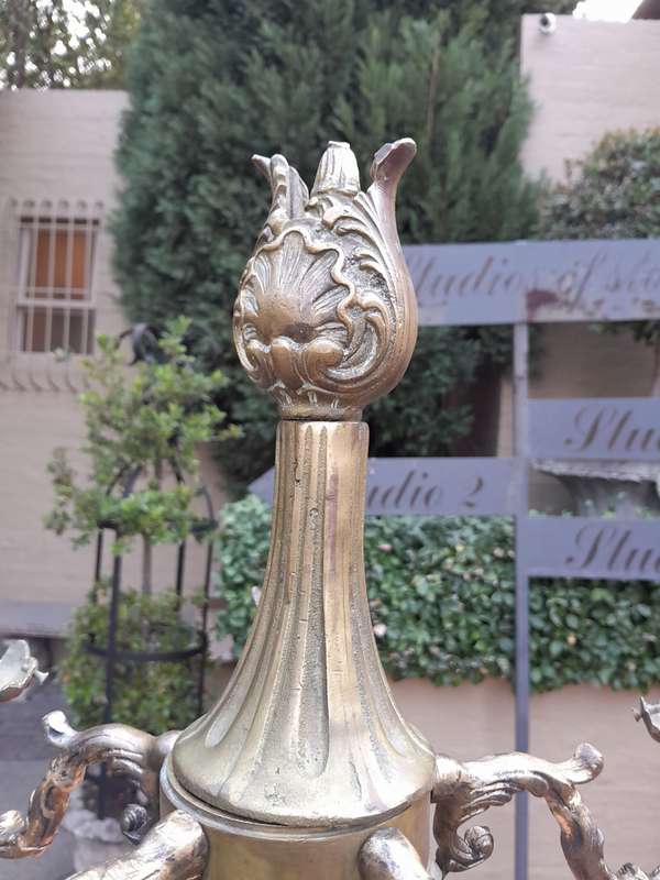 An Antique Brass And Bronze Five Arm Cherub Candelabra