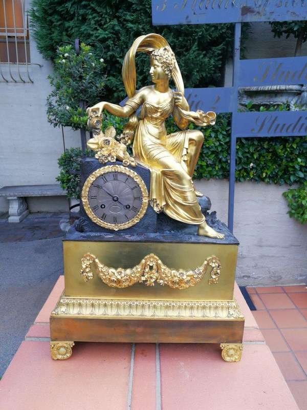 A Late 19th Century French Gilt And Bronze Clock With Pendulum