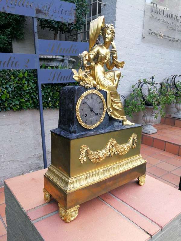 A Late 19th Century French Gilt And Bronze Clock With Pendulum