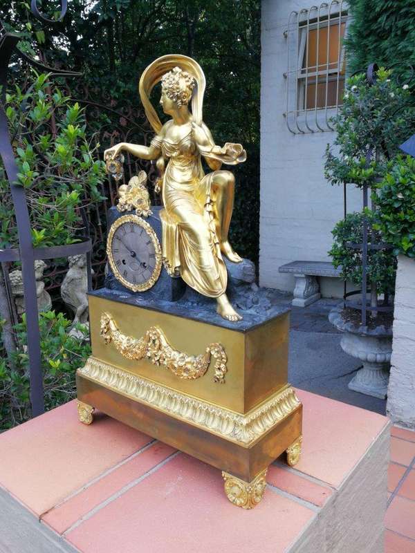A Late 19th Century French Gilt And Bronze Clock With Pendulum