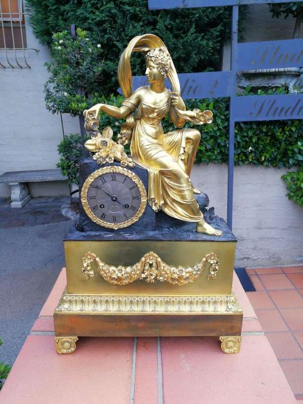 A Late 19th Century French Gilt And Bronze Clock With Pendulum