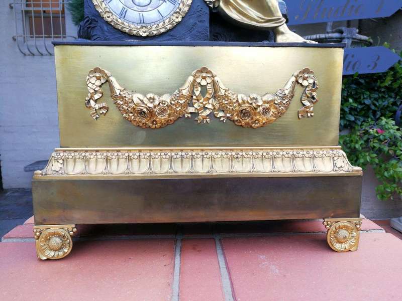 A Late 19th Century French Gilt And Bronze Clock With Pendulum