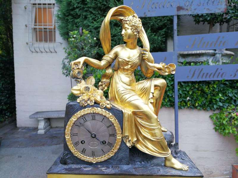 A Late 19th Century French Gilt And Bronze Clock With Pendulum
