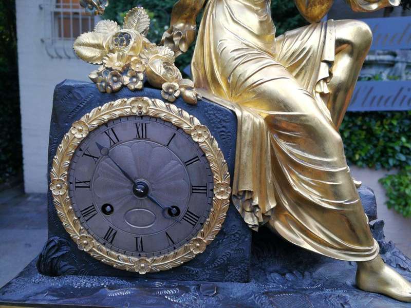 A Late 19th Century French Gilt And Bronze Clock With Pendulum