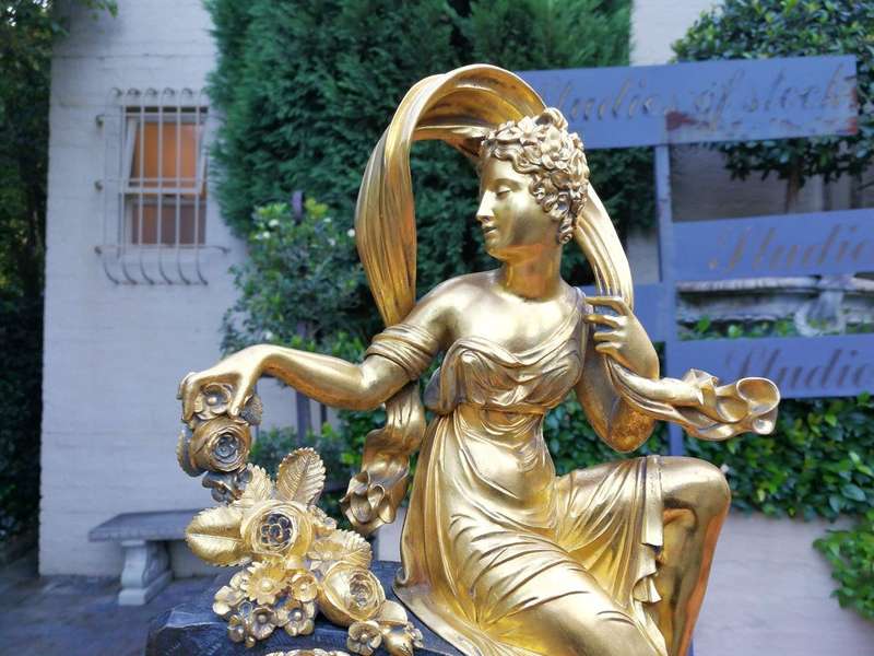 A Late 19th Century French Gilt And Bronze Clock With Pendulum