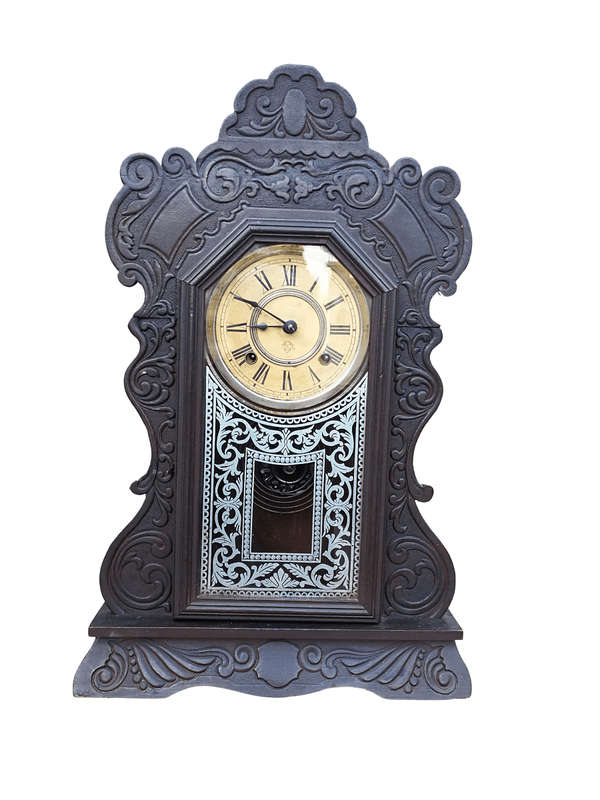 An Early 20th Century American Ebonised & Ornate Carved Oak Mantel Clock