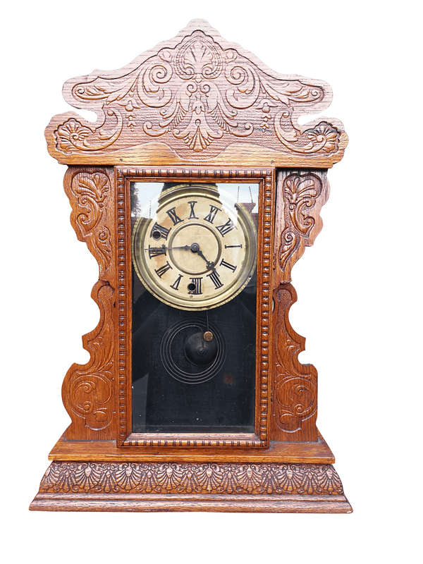 An Early 20th Century  Ornate Carved Oak Mantel Clock