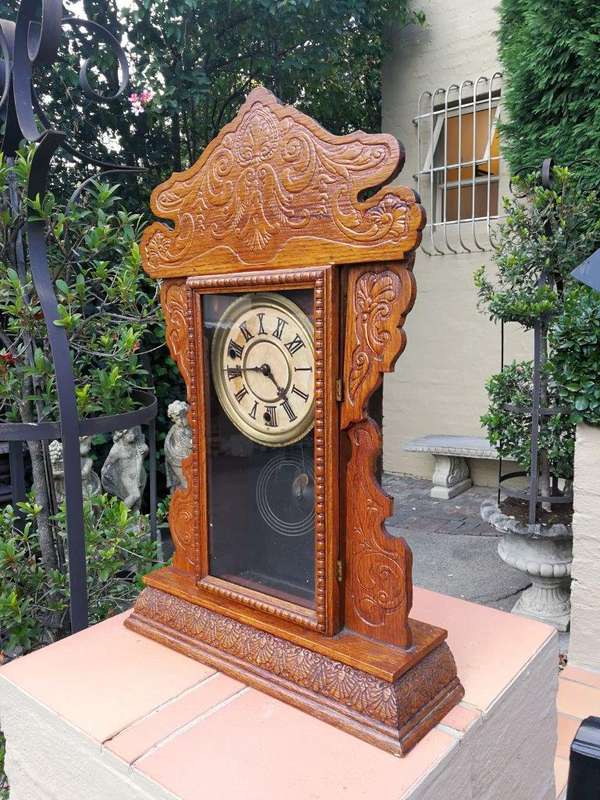 An Early 20th Century  Ornate Carved Oak Mantel Clock