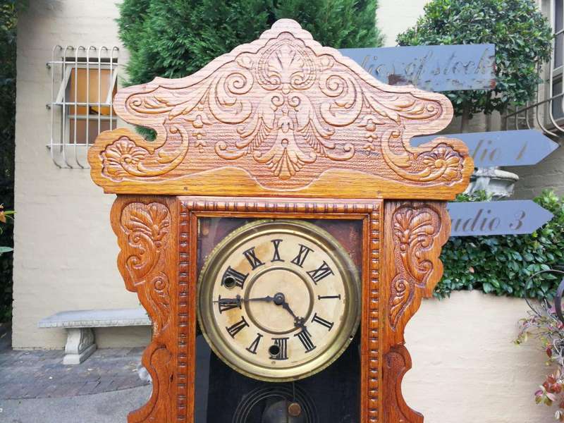 An Early 20th Century  Ornate Carved Oak Mantel Clock