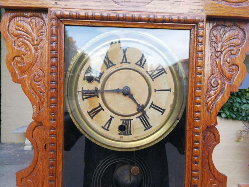 An Early 20th Century  Ornate Carved Oak Mantel Clock
