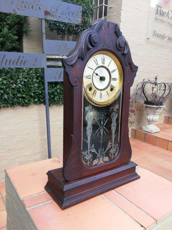 An Early 20th Century American Carved Oak Mantel Clock