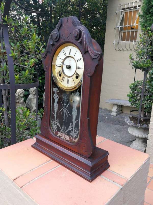 An Early 20th Century American Carved Oak Mantel Clock