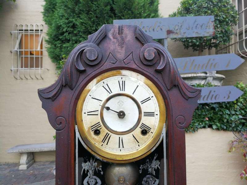 An Early 20th Century American Carved Oak Mantel Clock
