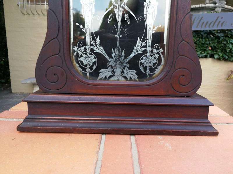 An Early 20th Century American Carved Oak Mantel Clock