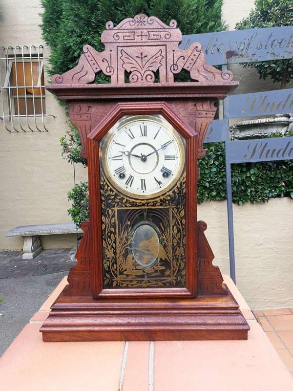 An Early 20th Century English Carved Walnut Mantel Clock