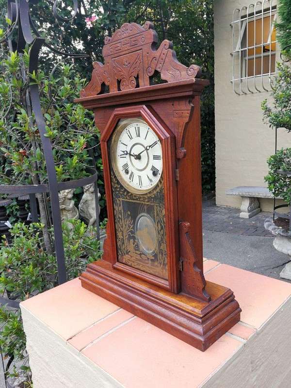 An Early 20th Century English Carved Walnut Mantel Clock