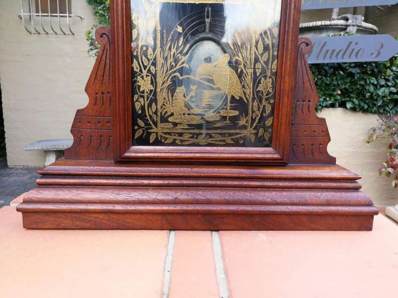 An Early 20th Century English Carved Walnut Mantel Clock