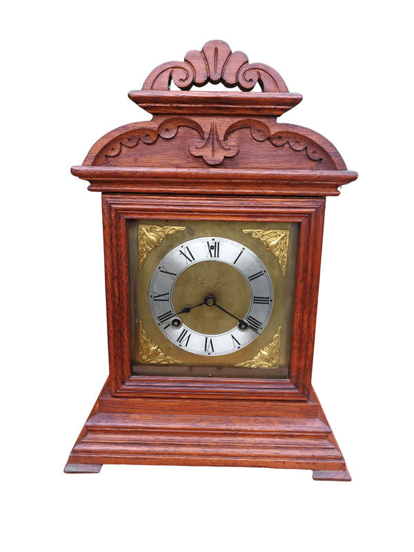An Antique Oak French Mantel Clock