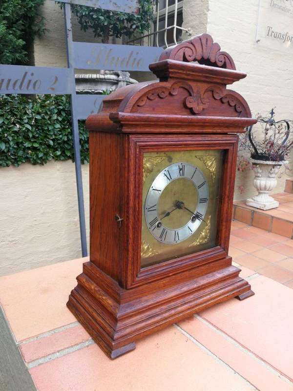 An Antique Oak French Mantel Clock