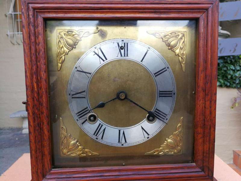 An Antique Oak French Mantel Clock