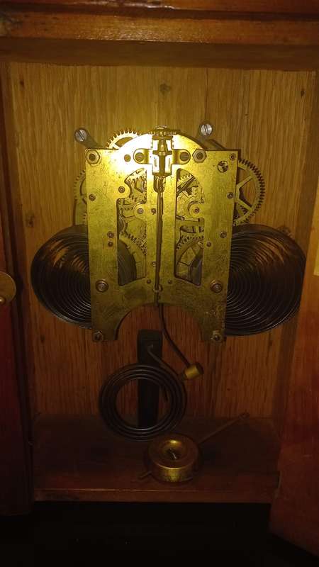 An Antique Oak French Mantel Clock