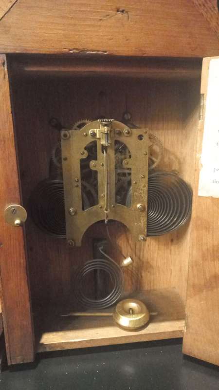 An Antique Oak French Mantel Clock