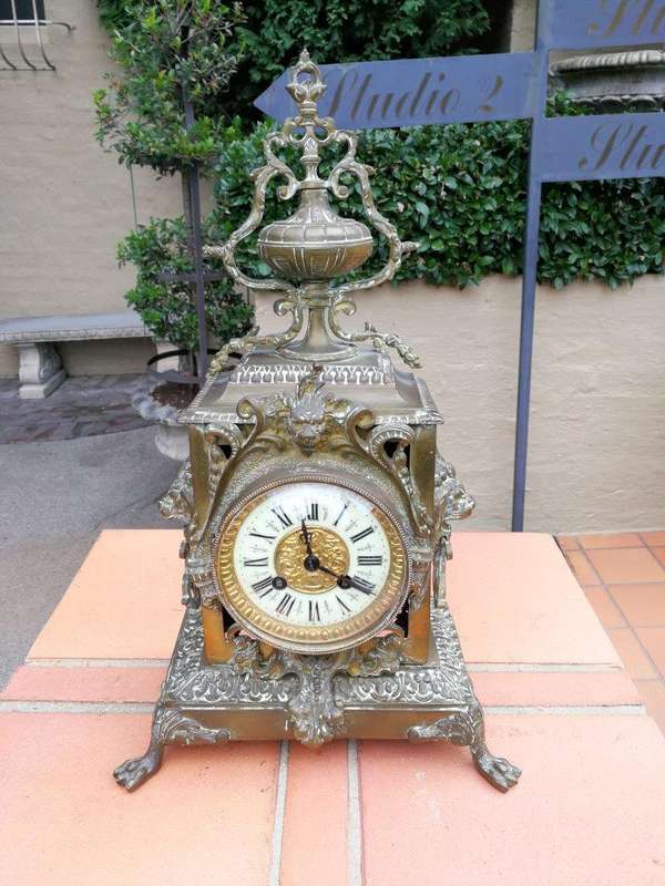 A late 19th/Early 20th Century French brass clock With Pendulum and Key