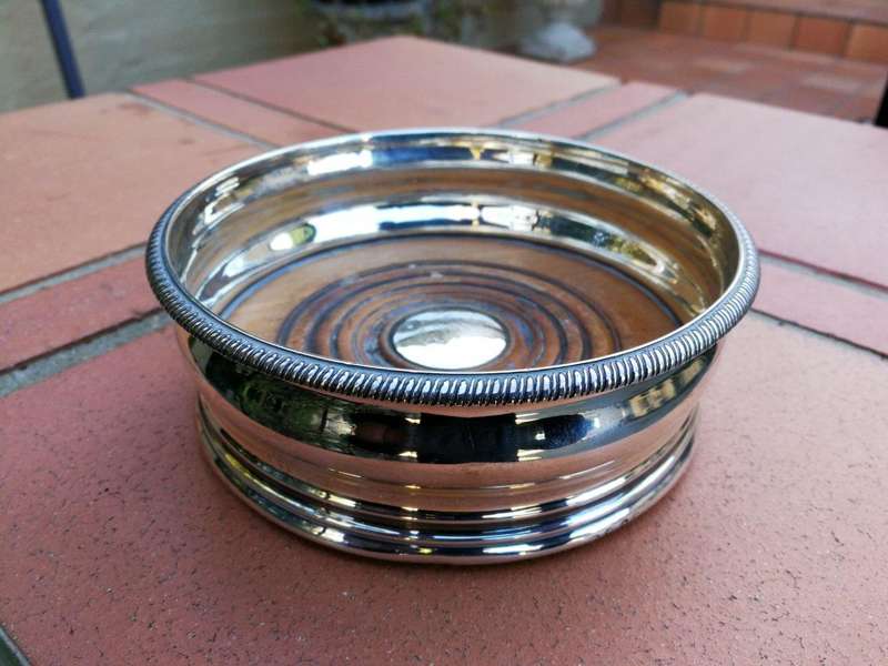 A Silver-Plated Wine Coaster with Wooden Base