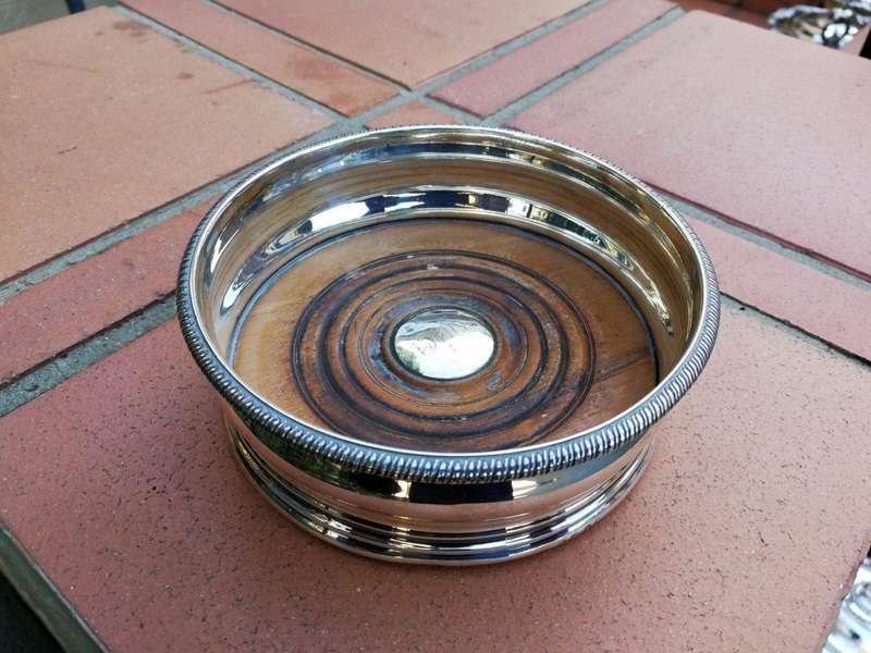 A Silver-Plated Wine Coaster with Wooden Base