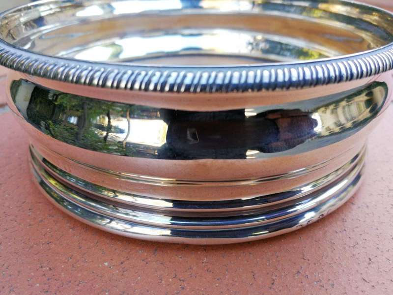 A Silver-Plated Wine Coaster with Wooden Base