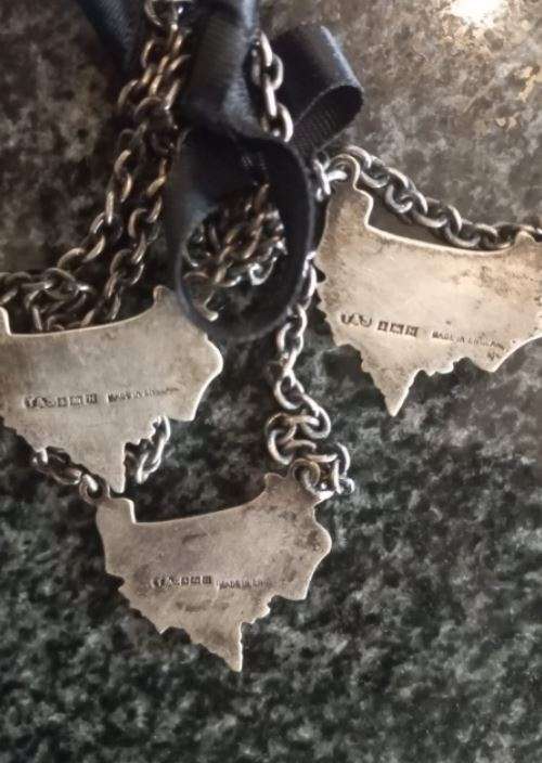 A Set of Three Birmingham Silver Decanter Labels Silver weight: 34 grams