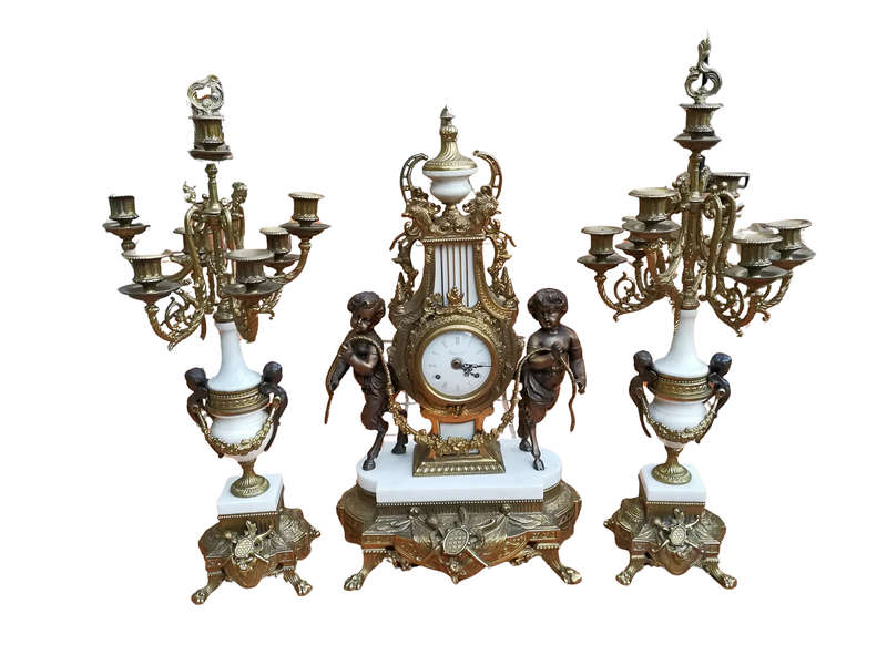 An Antique Circa Early 1900 Brass Garniture Clock Set with Key. Comprising a Clock and Pair of Ca...