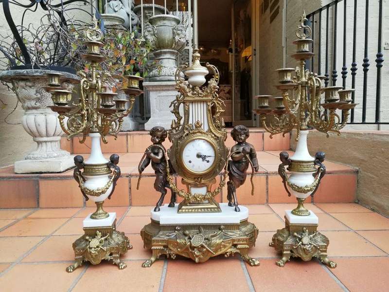 An Antique Circa Early 1900 Brass Garniture Clock Set with Key. Comprising a Clock and Pair of Ca...