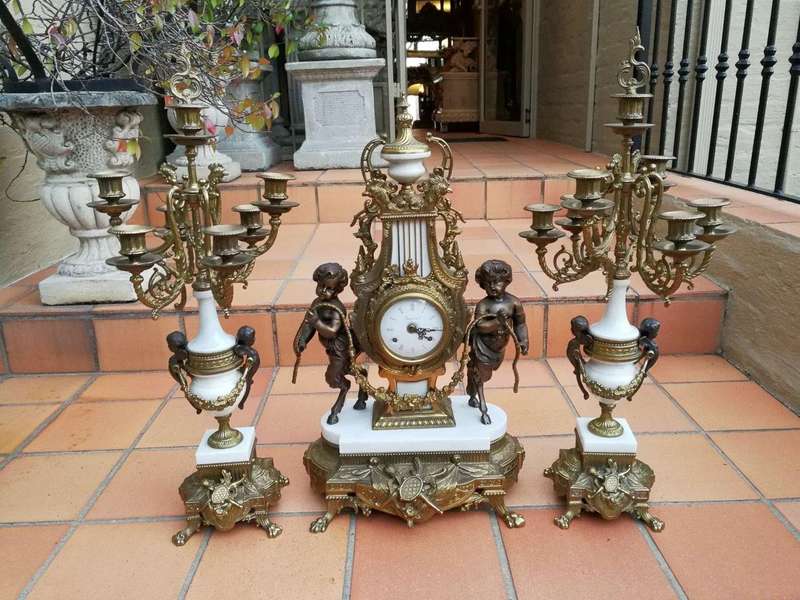 An Antique Circa Early 1900 Brass Garniture Clock Set with Key. Comprising a Clock and Pair of Ca...