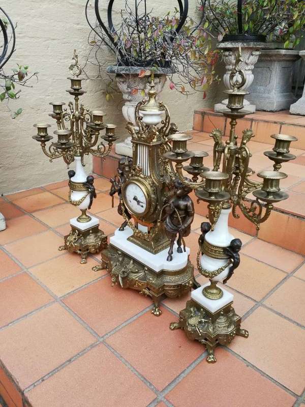 An Antique Circa Early 1900 Brass Garniture Clock Set with Key. Comprising a Clock and Pair of Ca...