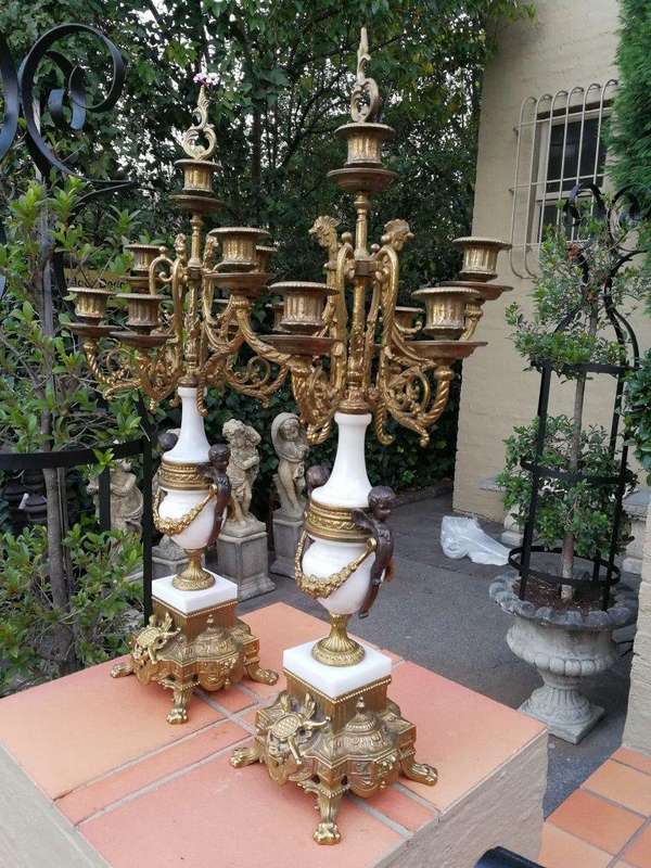 An Antique Circa Early 1900 Brass Garniture Clock Set with Key. Comprising a Clock and Pair of Ca...