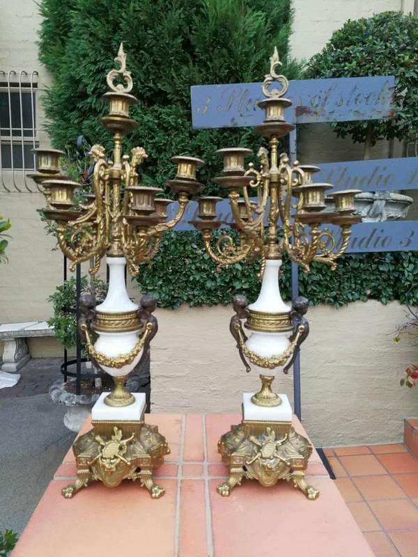 An Antique Circa Early 1900 Brass Garniture Clock Set with Key. Comprising a Clock and Pair of Ca...