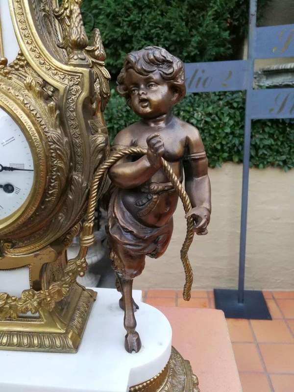 An Antique Circa Early 1900 Brass Garniture Clock Set with Key. Comprising a Clock and Pair of Ca...
