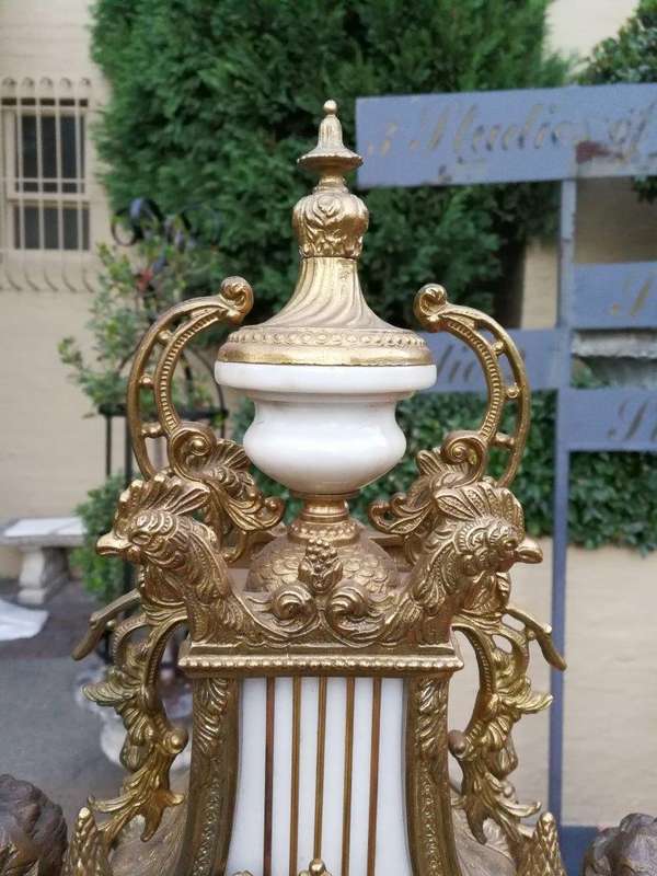 An Antique Circa Early 1900 Brass Garniture Clock Set with Key. Comprising a Clock and Pair of Ca...