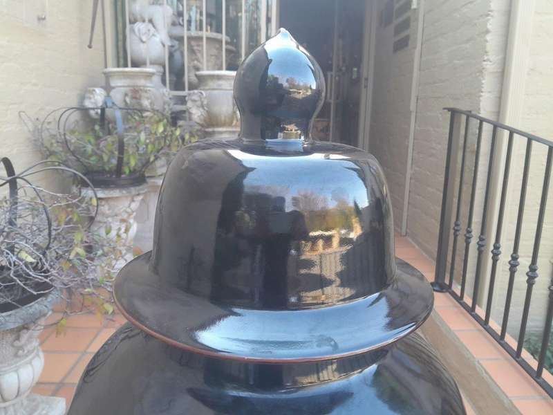 A Large Size Black Ceramic Ginger Car With Cover On A Chinese Wooden Stand