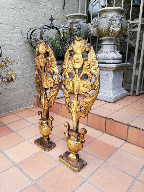 An Early 20TH Century Pair Of Gilt-Wood Carved Decorative Objects