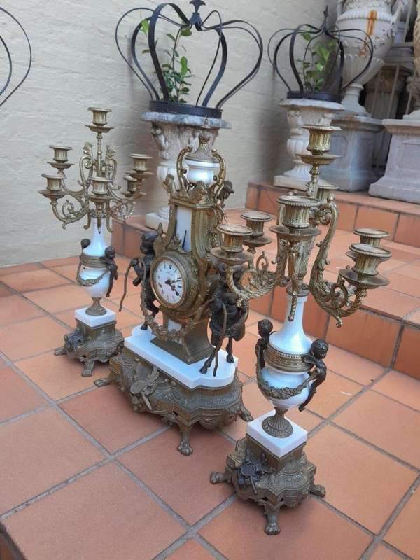 A 20th Century Brass Clock And Candelabrum Garniture Set