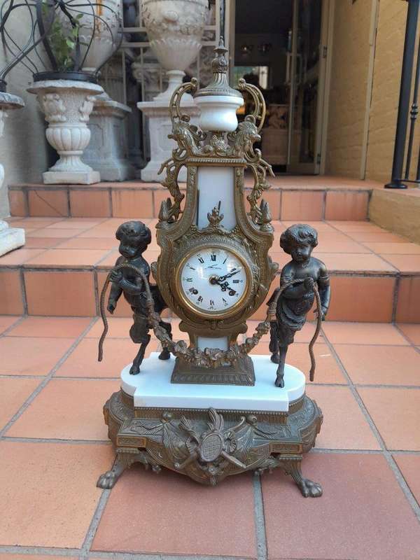 A 20th Century Brass Clock And Candelabrum Garniture Set