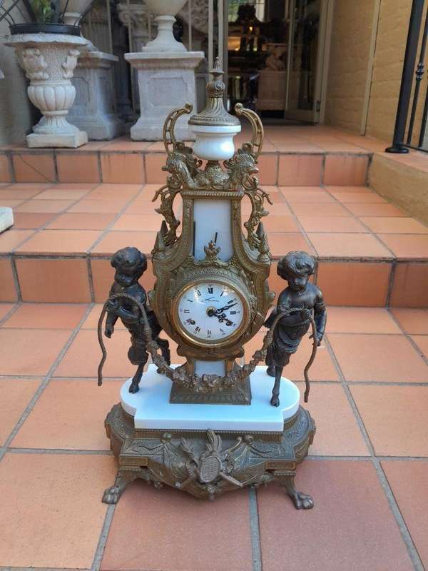 A 20th Century Brass Clock And Candelabrum Garniture Set
